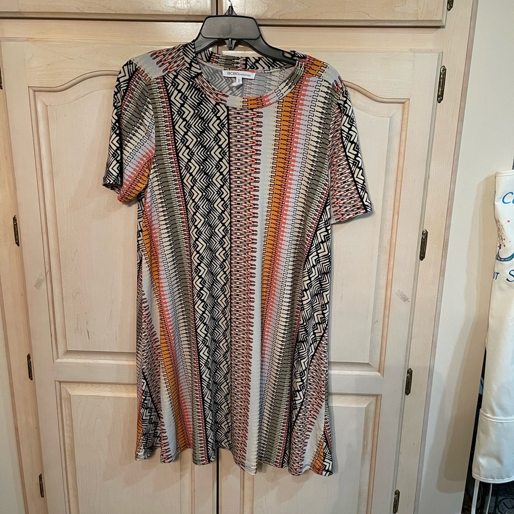 A BCBG generation swing type dress. Size L with a mixture of southwestern hues.